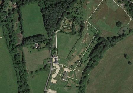 Satellite images of a woodland burial complex. The main buildings and the surrounding woodland burials site.